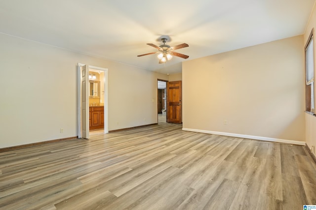 unfurnished room featuring light wood-type flooring and ceiling fan