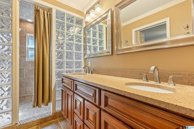 bathroom with vanity, crown molding, and tile patterned floors