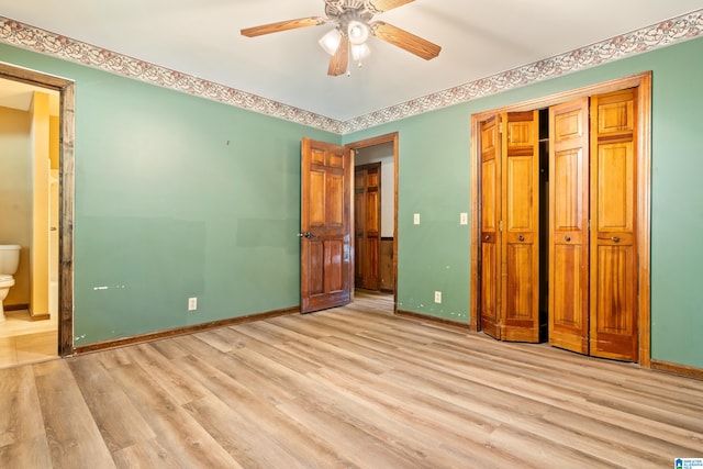 unfurnished bedroom with light hardwood / wood-style floors, ensuite bathroom, and ceiling fan