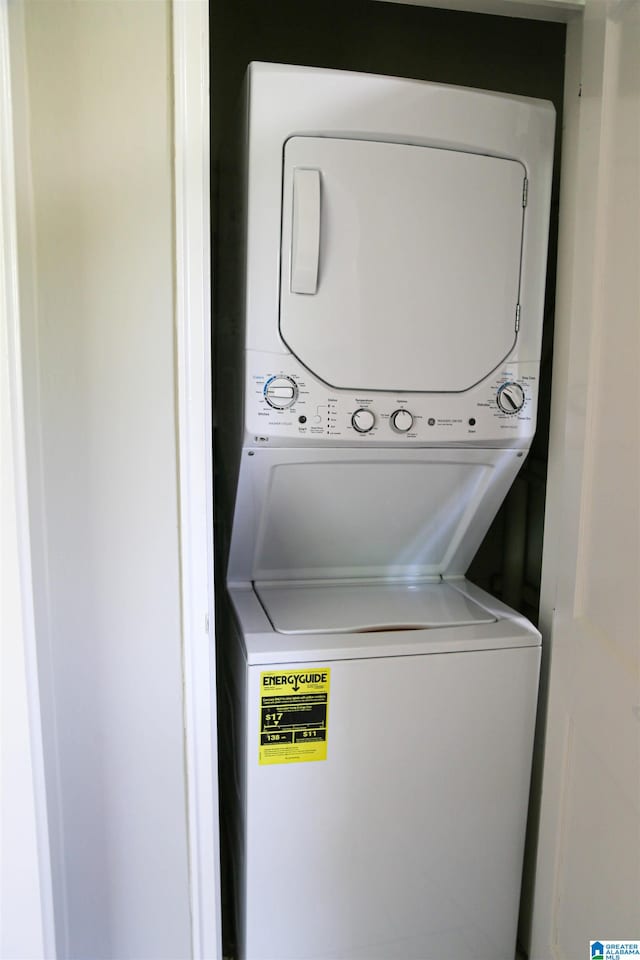 washroom with stacked washer / drying machine