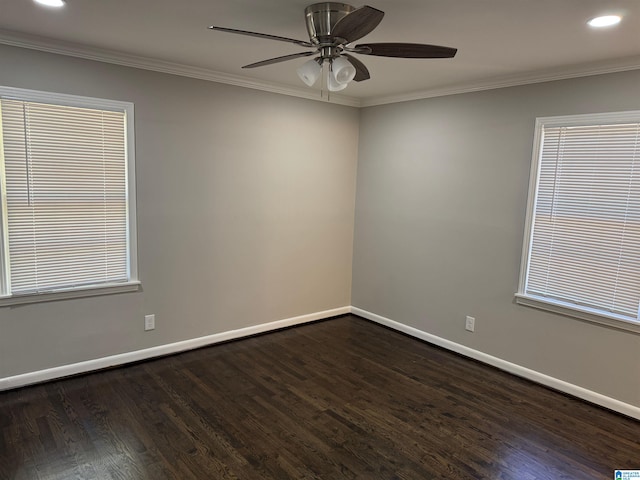 empty room featuring ornamental molding, dark hardwood / wood-style floors, and ceiling fan