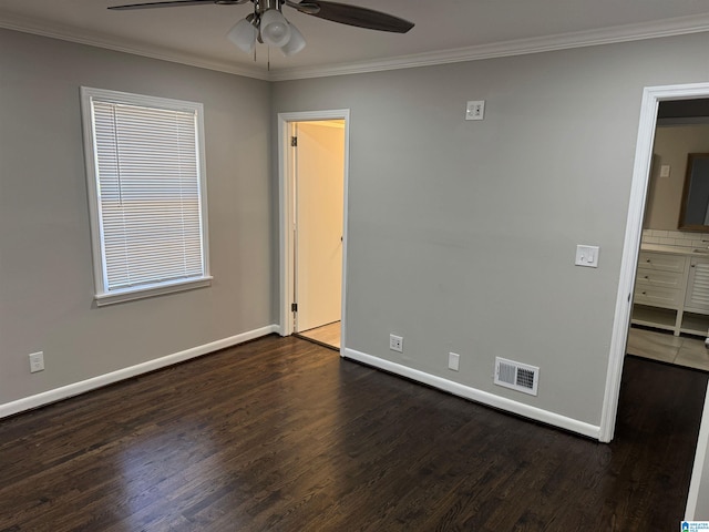 unfurnished room featuring crown molding, dark hardwood / wood-style flooring, and ceiling fan