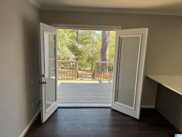 doorway to outside with dark wood-type flooring, crown molding, and a healthy amount of sunlight