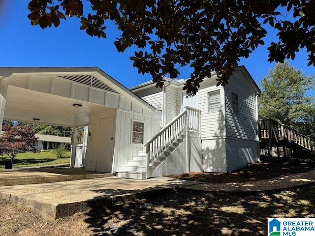 exterior space with a carport