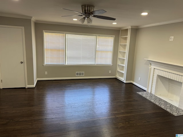 unfurnished living room featuring ornamental molding, ceiling fan, a brick fireplace, and dark hardwood / wood-style flooring