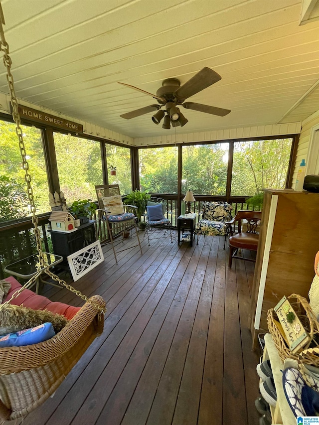 sunroom / solarium featuring a wealth of natural light and ceiling fan