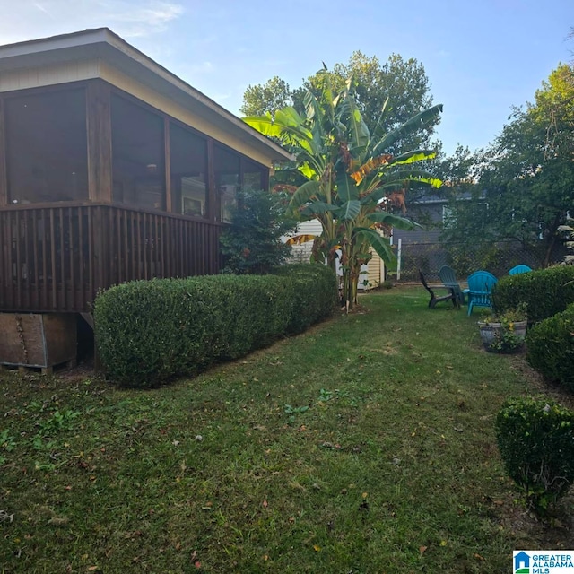 view of yard with a sunroom