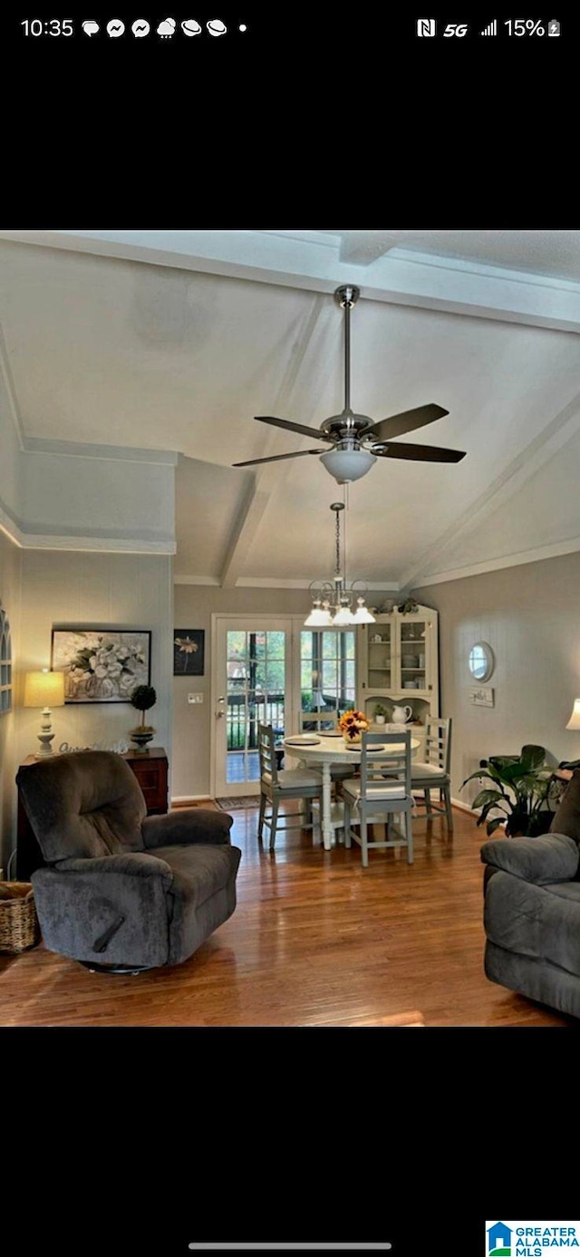 interior space with lofted ceiling with beams, wood finished floors, and a ceiling fan