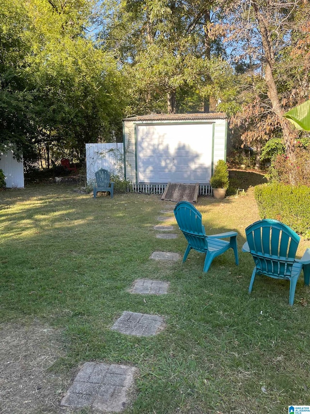 view of yard with an outdoor structure and a shed