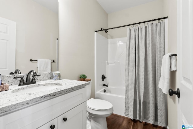 full bathroom featuring vanity, shower / bath combo, wood-type flooring, and toilet