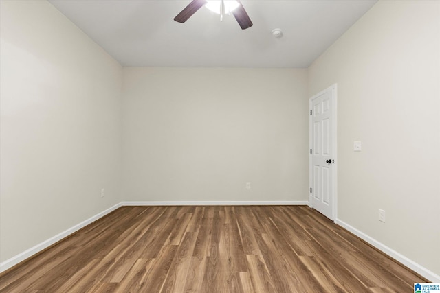 empty room with hardwood / wood-style floors and ceiling fan