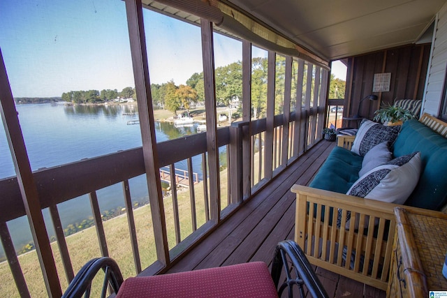 sunroom / solarium with a water view