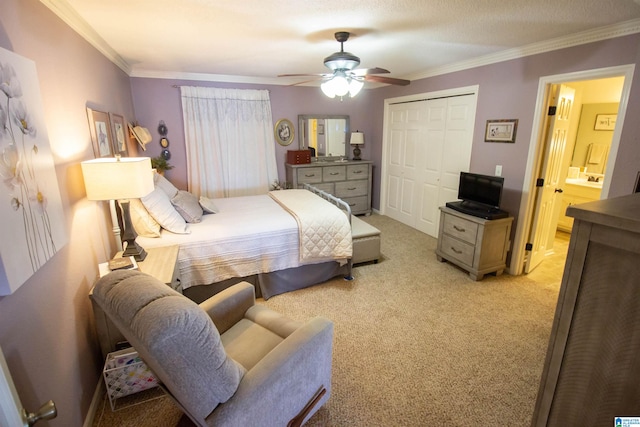 bedroom featuring a closet, ceiling fan, ornamental molding, and light colored carpet