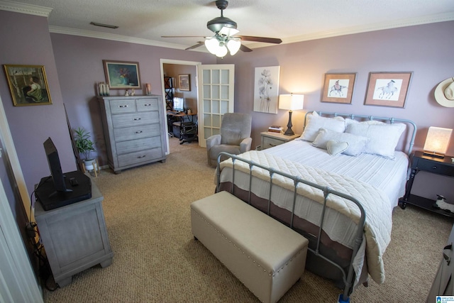 carpeted bedroom with ornamental molding, a textured ceiling, and ceiling fan