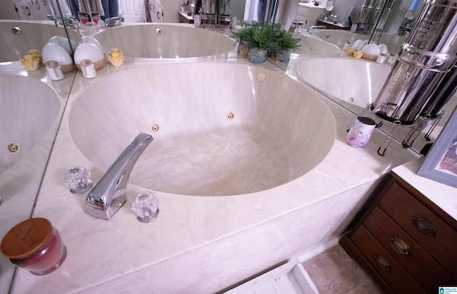 bathroom featuring vanity and a bathing tub