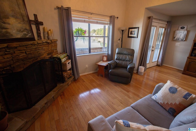 living room featuring light hardwood / wood-style floors and a fireplace