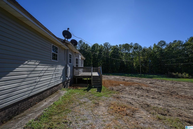 view of yard with a wooden deck