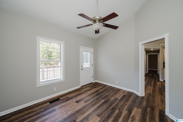 foyer featuring ceiling fan, high vaulted ceiling, and dark hardwood / wood-style floors