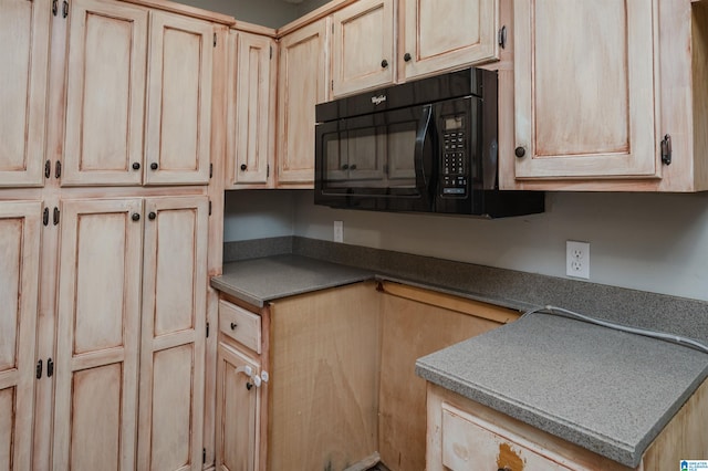 kitchen featuring light brown cabinetry