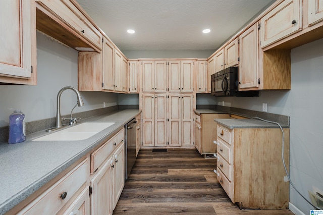 kitchen featuring stainless steel dishwasher, sink, dark wood-type flooring, and light brown cabinetry