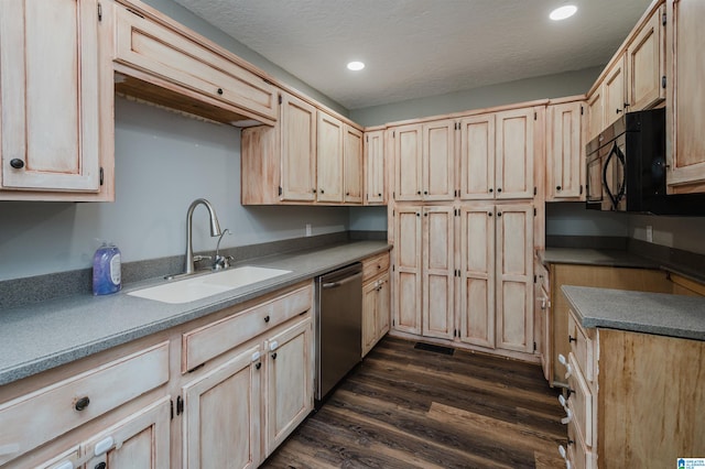 kitchen featuring a textured ceiling, stainless steel dishwasher, light brown cabinetry, dark hardwood / wood-style floors, and sink