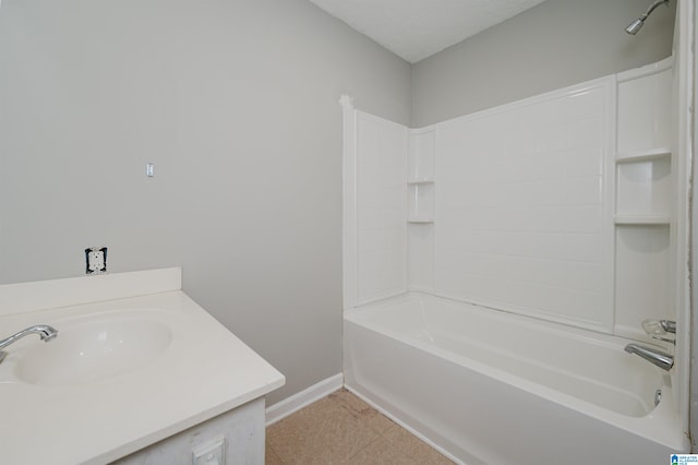 bathroom featuring vanity, shower / bath combination, tile patterned floors, and a textured ceiling