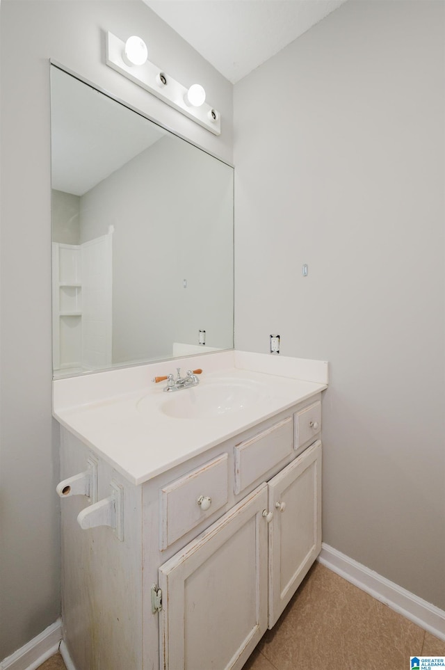 bathroom with vanity and tile patterned floors