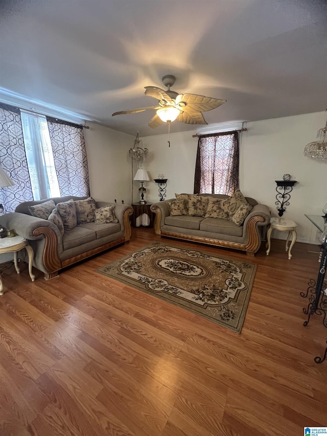 living room featuring wood finished floors and ceiling fan