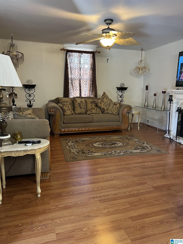 living room featuring ceiling fan and wood finished floors