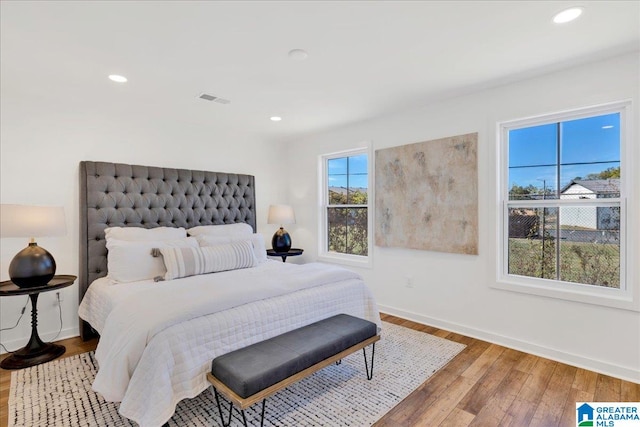 bedroom with hardwood / wood-style floors