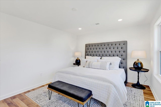 bedroom with hardwood / wood-style floors