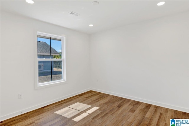 spare room featuring hardwood / wood-style floors