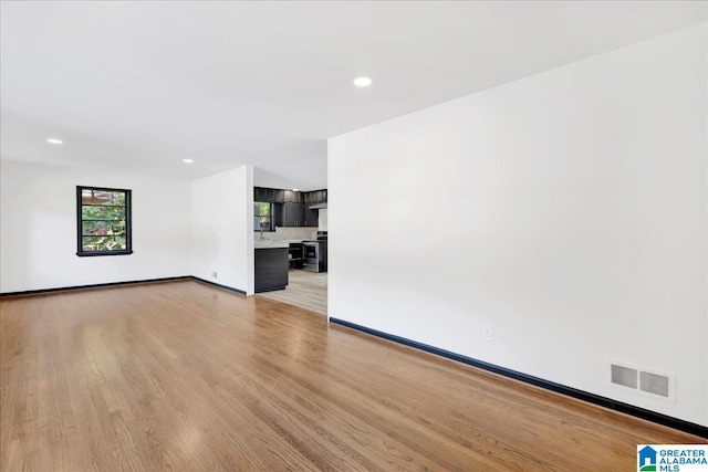 unfurnished living room with light wood-type flooring