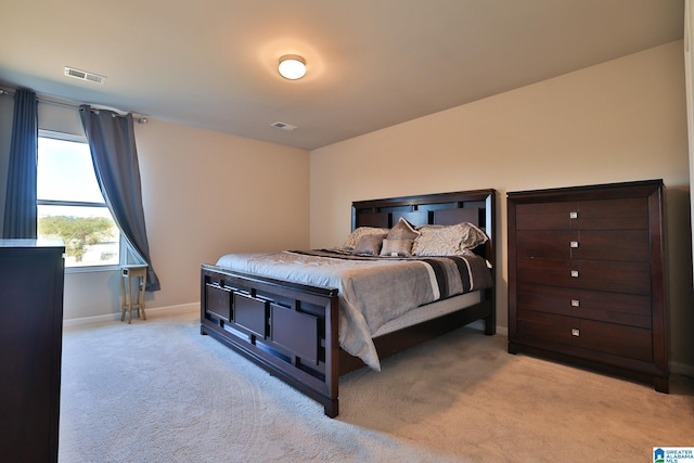 bedroom featuring light colored carpet