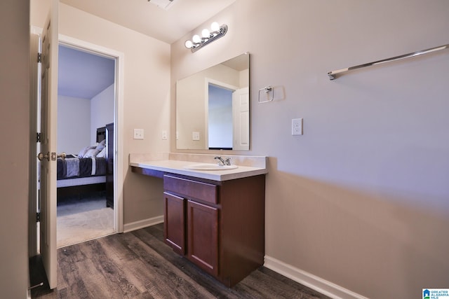 bathroom featuring vanity and hardwood / wood-style flooring