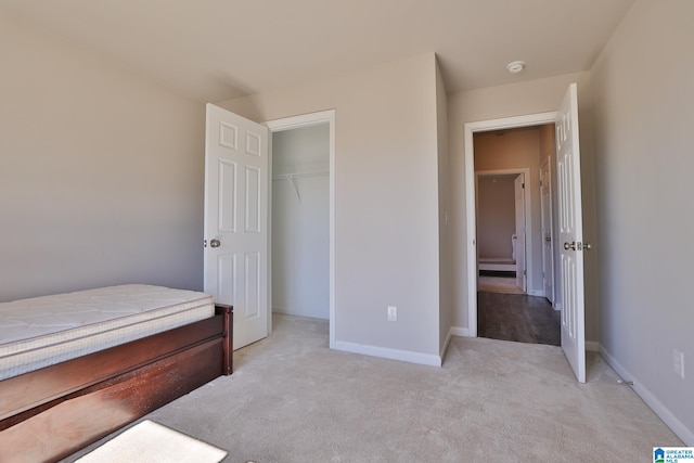 carpeted bedroom with a closet