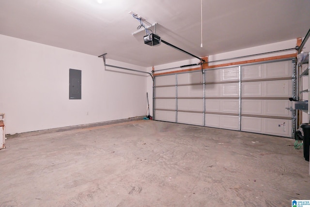 garage featuring electric panel and a garage door opener