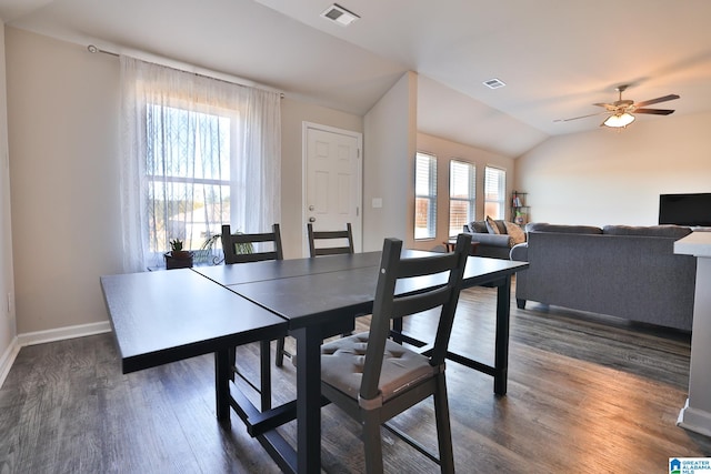 dining room featuring lofted ceiling, dark wood-type flooring, and ceiling fan