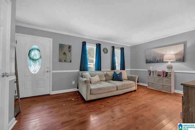 living room featuring ornamental molding, plenty of natural light, and hardwood / wood-style floors