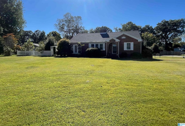 single story home with a front lawn