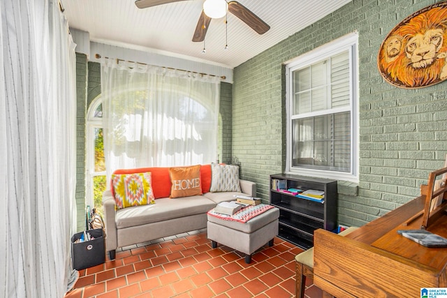 interior space with ceiling fan