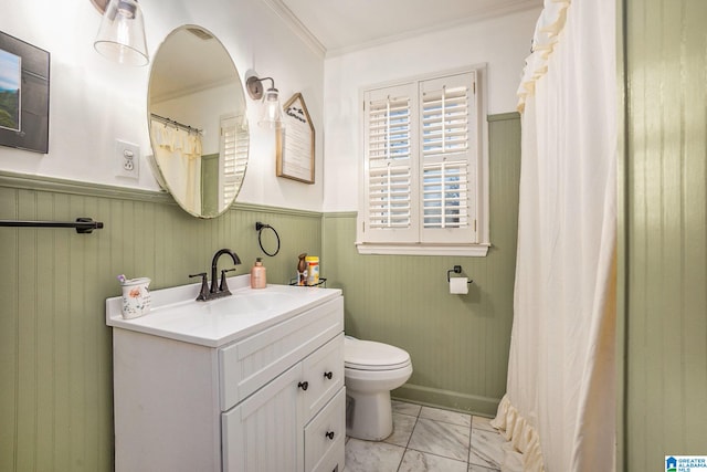 bathroom with vanity, crown molding, a shower with shower curtain, and toilet