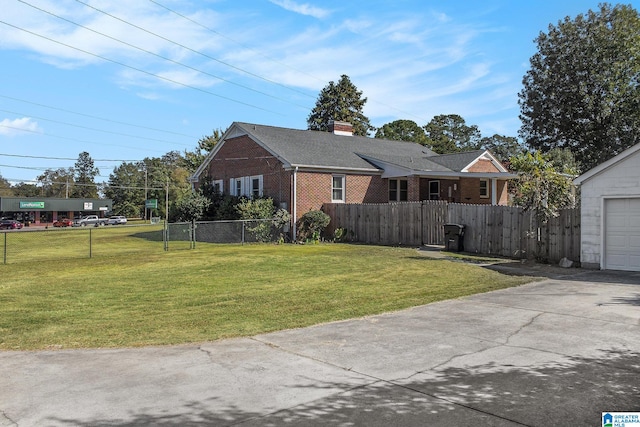 view of front facade featuring a garage and a front lawn