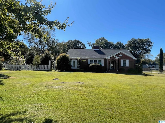 ranch-style home with a front yard