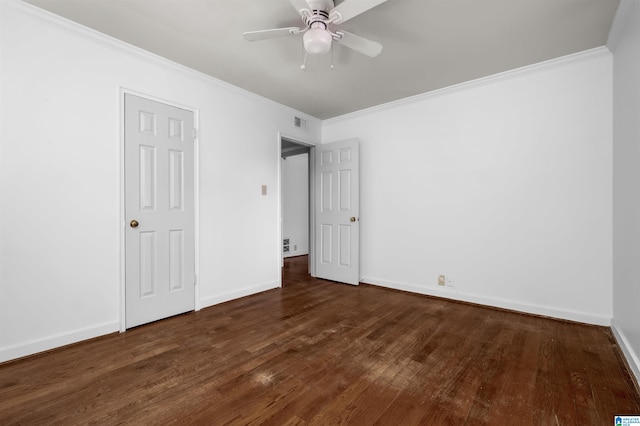 unfurnished bedroom featuring dark wood-type flooring, crown molding, and ceiling fan