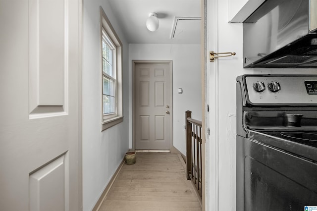 laundry room with light hardwood / wood-style floors