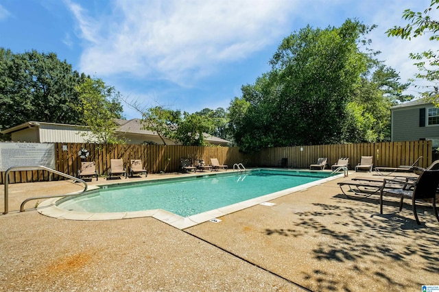 view of swimming pool featuring a patio area