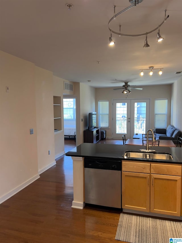 kitchen featuring ceiling fan, stainless steel dishwasher, sink, and dark hardwood / wood-style flooring