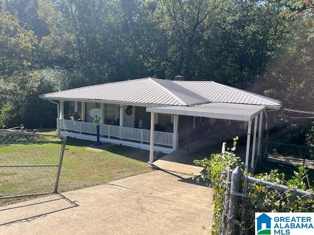 view of front of home with a front lawn and covered porch