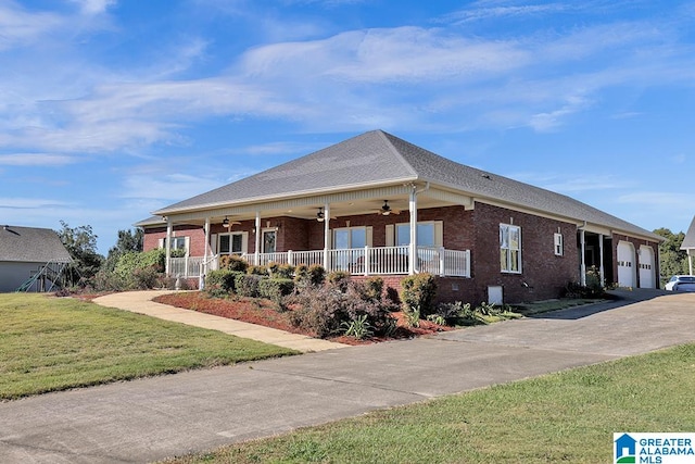 ranch-style home featuring ceiling fan, a front yard, a porch, and a garage